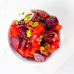Beet salad in a bowl with goat cheese.