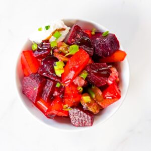 Beet salad in a bowl with goat cheese.