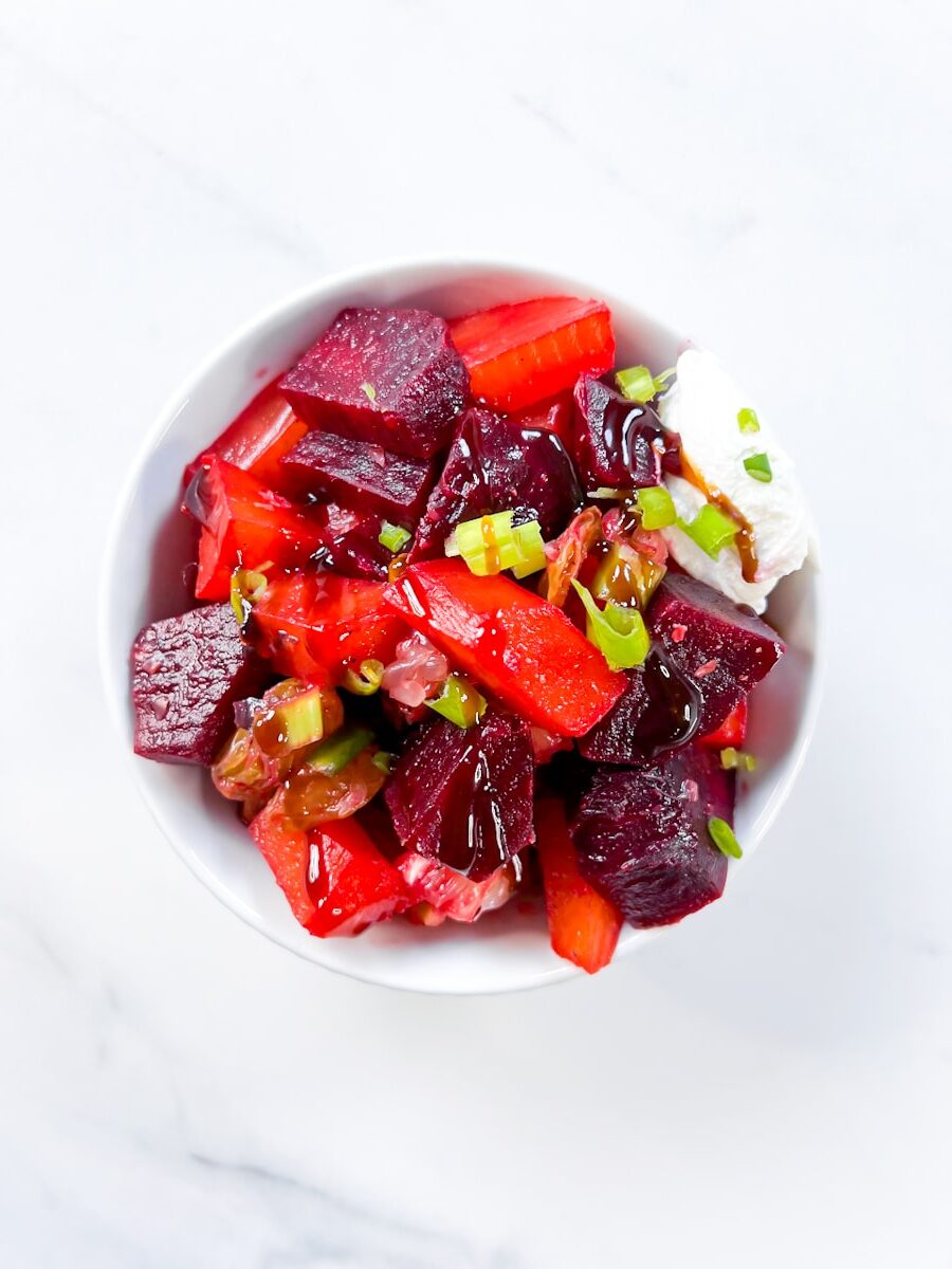 Beet salad with goat cheese in a bowl.