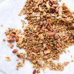 Pan toasted coconut granola on parchment paper.