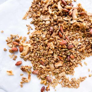 Pan toasted coconut granola on parchment paper.
