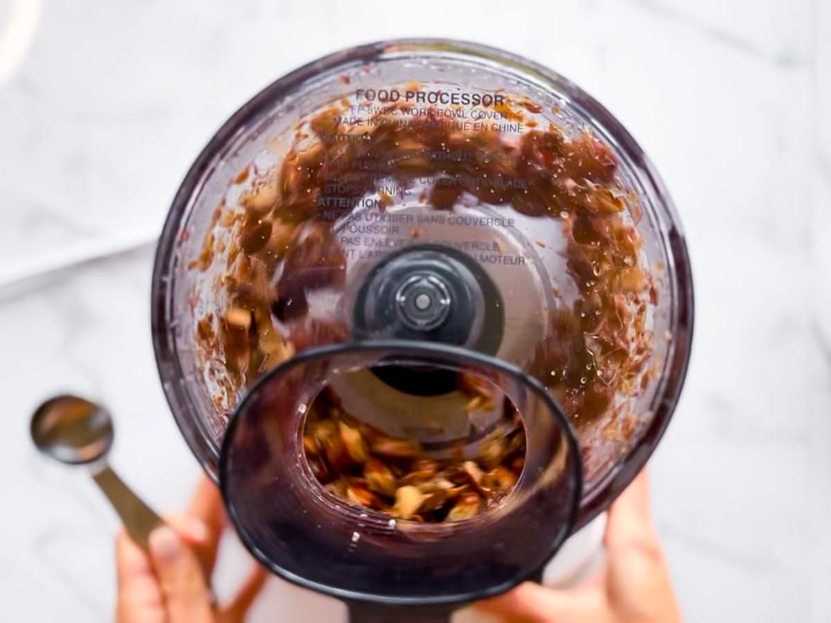 Date ball ingredients being blended in the food processor.