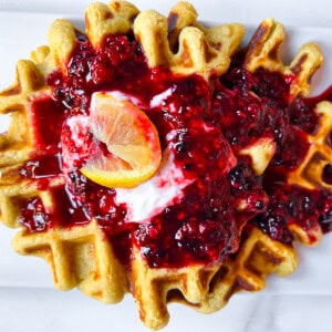 Healthy oat flour waffle on a plate with toppings.