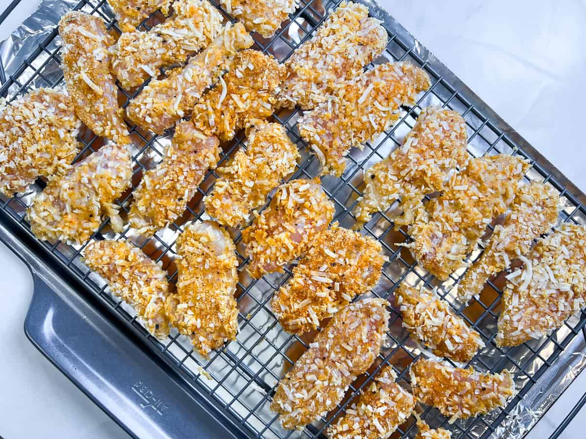 Coconut crusted chicken on the wire baking rack.