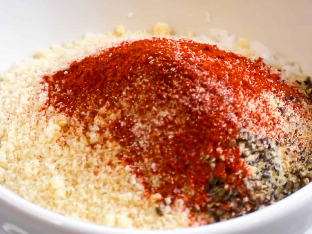 Almond flour, paprika, and other spices in a bowl.