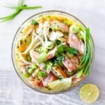 Asian noodle soup in a clear bowl.