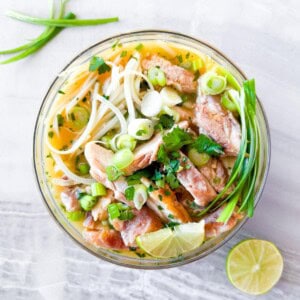 Asian noodle soup in a clear bowl.