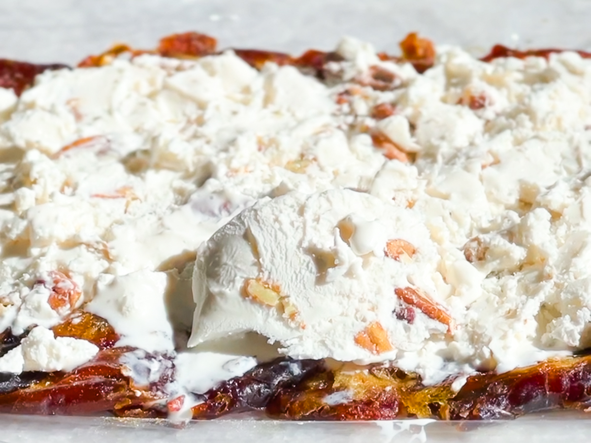 Coconut ice cream spread on top of medjool dates.