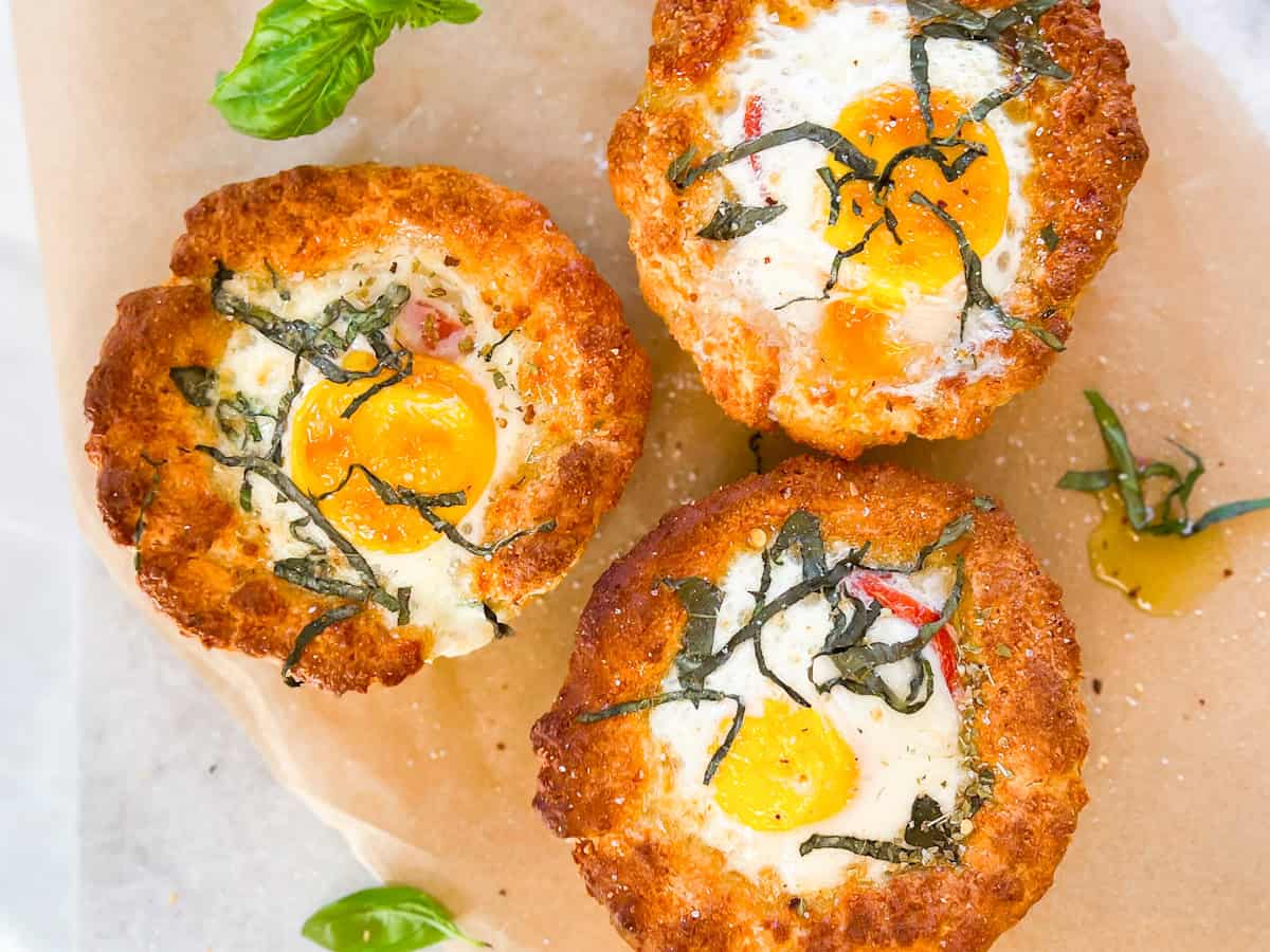 Gluten free bread bowls filled with baked eggs.