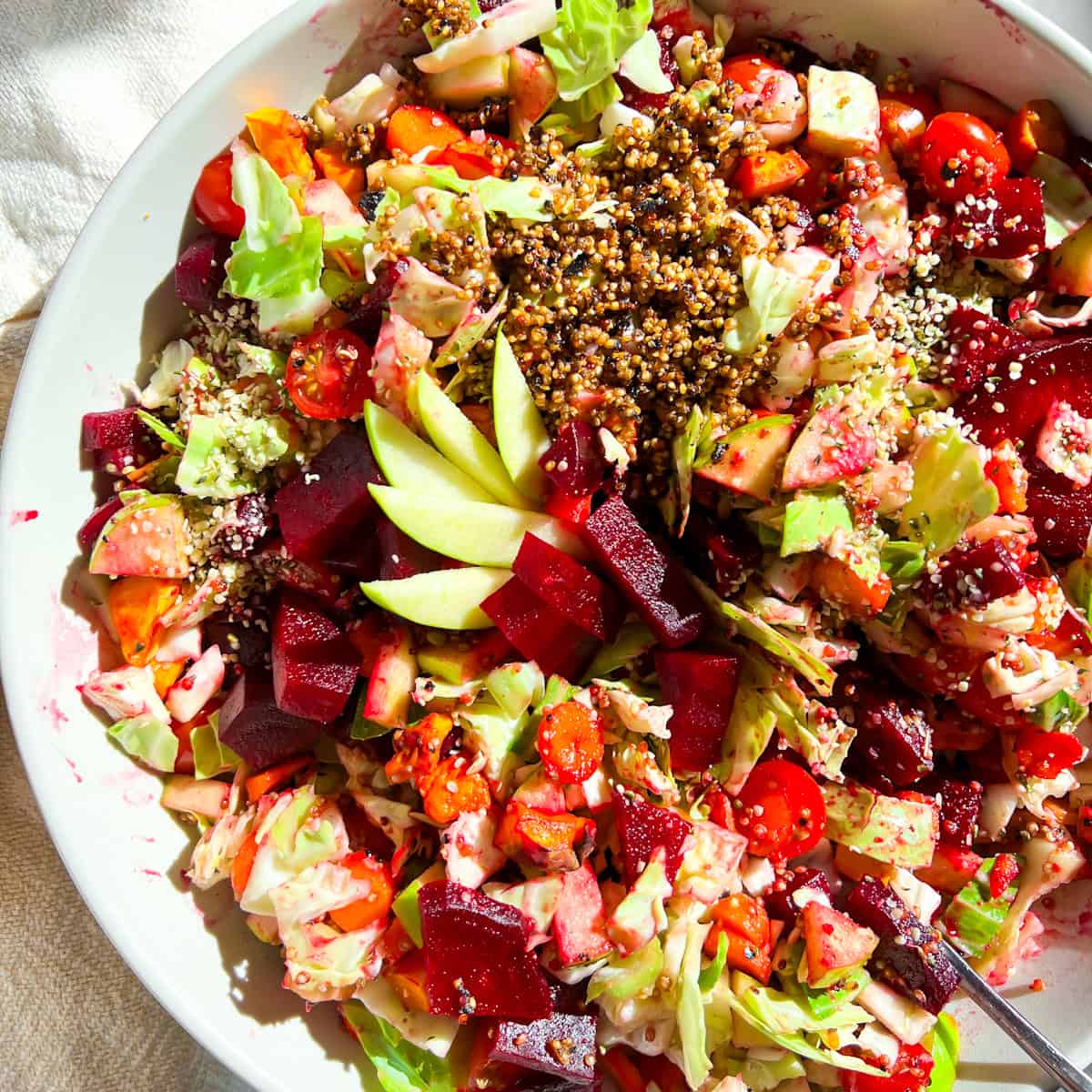 Big quinoa, roasted beet salad in a bowl.