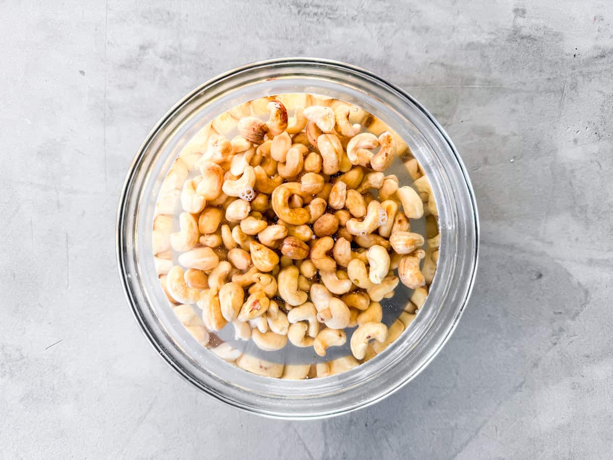 Cashews soaking in hot water.