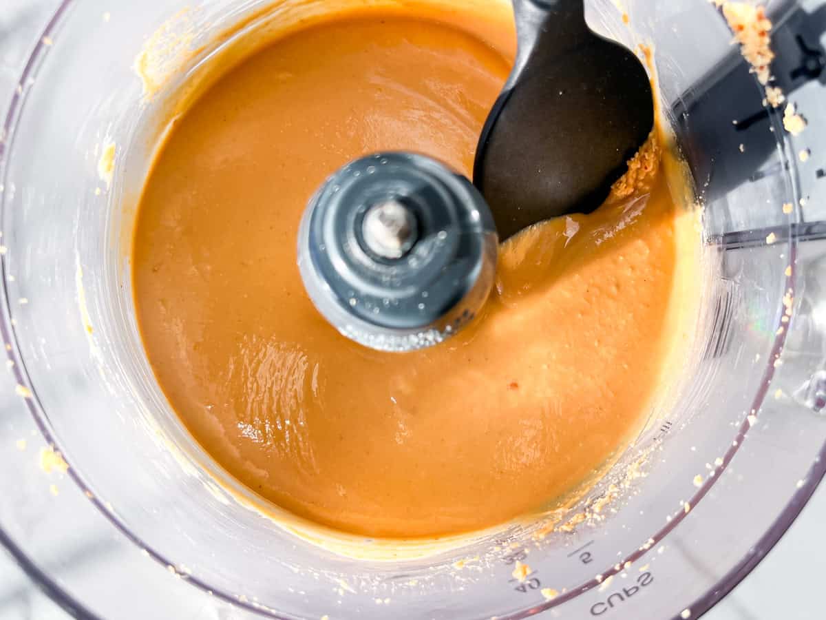 Fully blended cinnamon peanut butter in a food processor.
