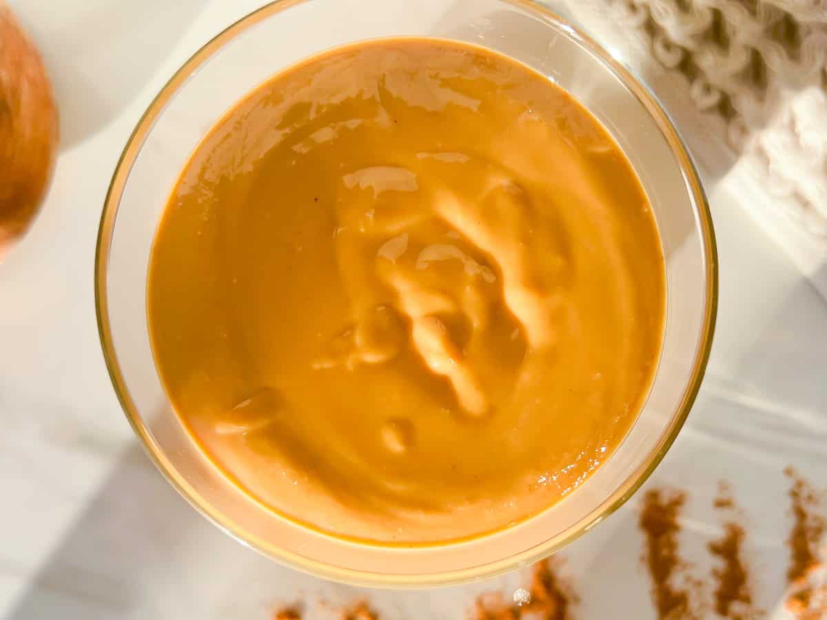 Cinnamon peanut butter in a glass jar.