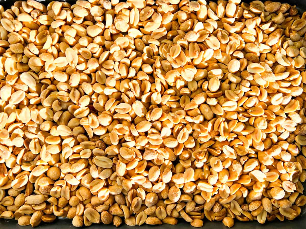 Roasted peanuts on a baking sheet.