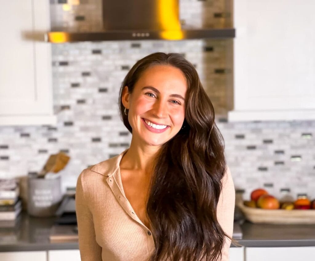 Emmy Standing in the kitchen for the homepage.