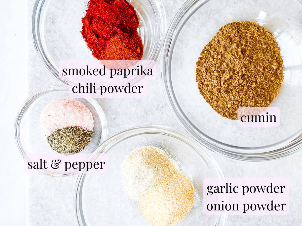 Chicken taco seasoning ingredients in bowls.