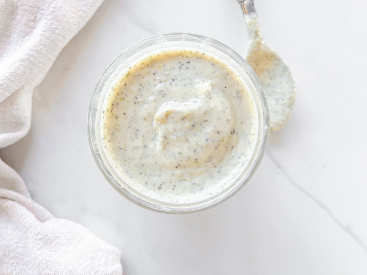 Finished garlic parmesan sauce in a jar.