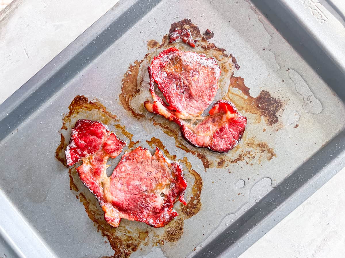 Crispy bacon on a baking sheet.