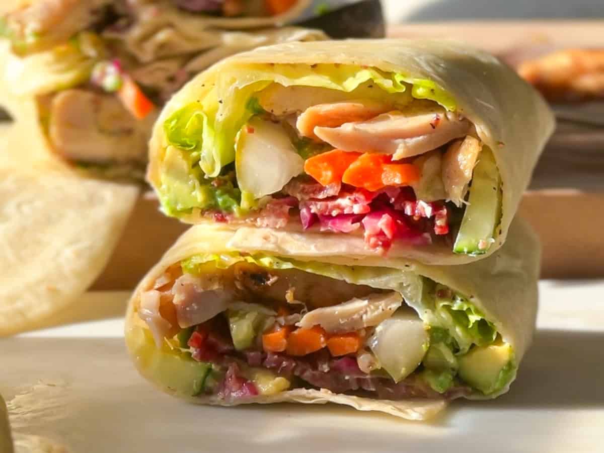 Finished honey mustard chicken wrap cut and stacked.