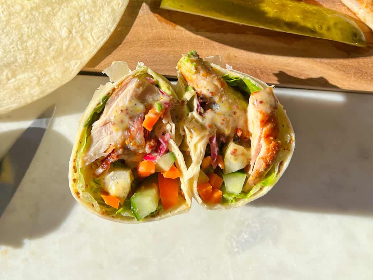 Finished honey mustard chicken wrap cut in half.