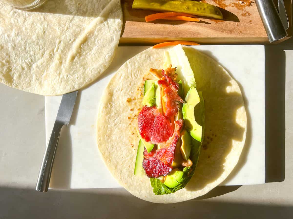 Honey mustard wrap being assembled.