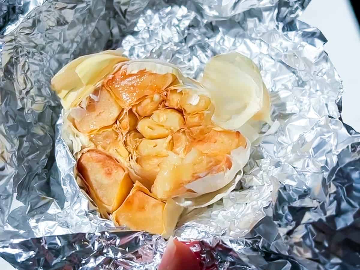 Roasted garlic bulb in tinfoil.