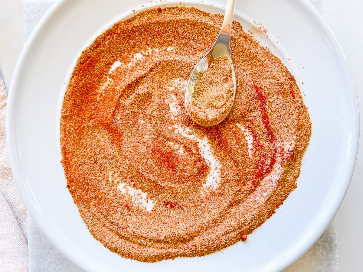 Homemade chicken taco seasoning mixed in a small bowl.