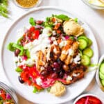 A photo with a cava bowl on a white plate and words saying copycat cava bowls.