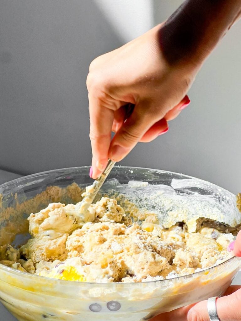 Stirring the batter for the banana chocolate chunk muffins.