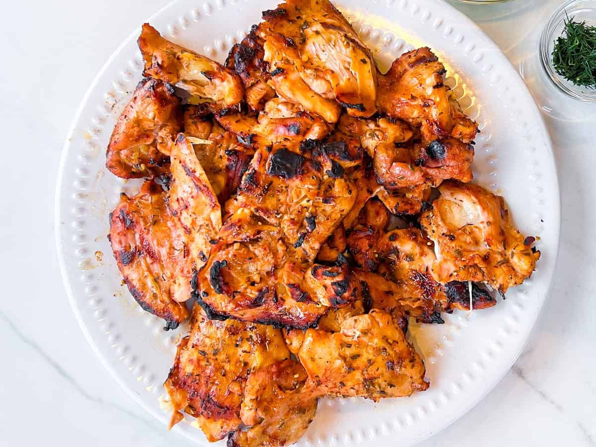 grilled chicken on a white plate.