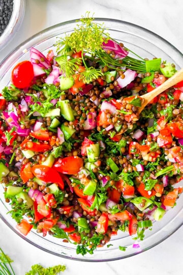 Lentil Tabbouleh in a big clear bowl.