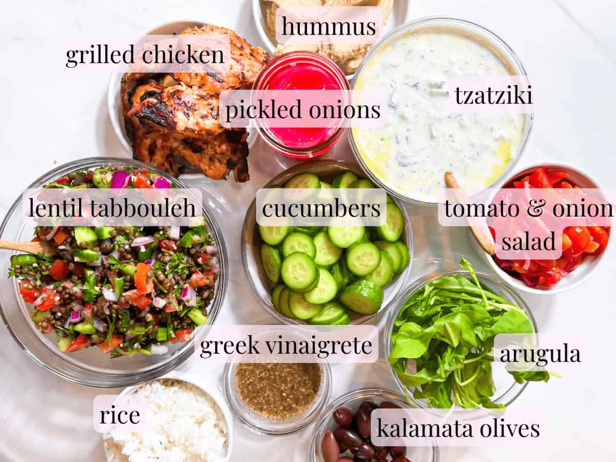 All of the ingredients for the cava bowls in bowls and labeled.