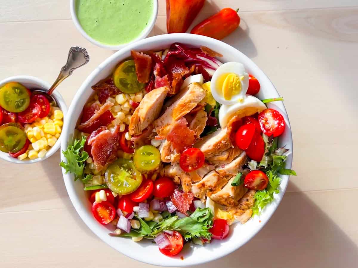 Finished Chick-Fil-A Cobb Salad with chicken, bacon, hard boiled eggs, and fresh vegtables.