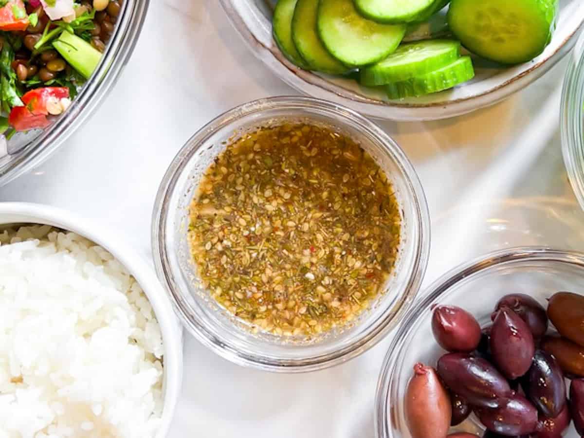 Cava Greek vinaigrette in a small clear bowl.