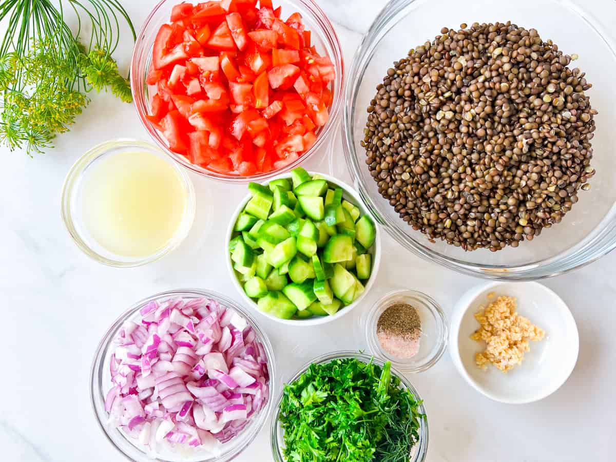 lentil tabbouleh ingredients prepared in glass bowls.