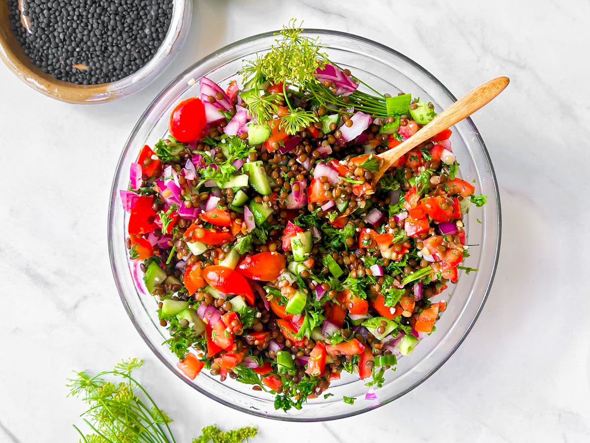 Finished Lentil Tabbouleh Salad in a large glass bowl.