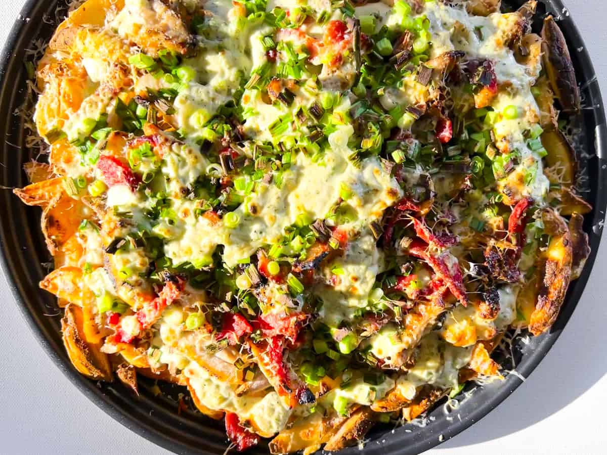 Easy Loaded French Fries on a large sheet pan.