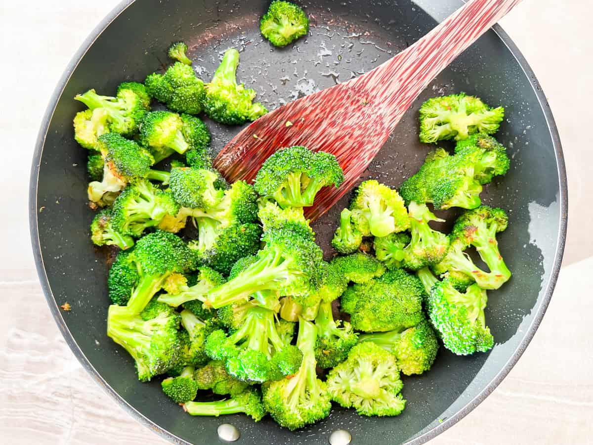 Sautéed broccoli in a pan.