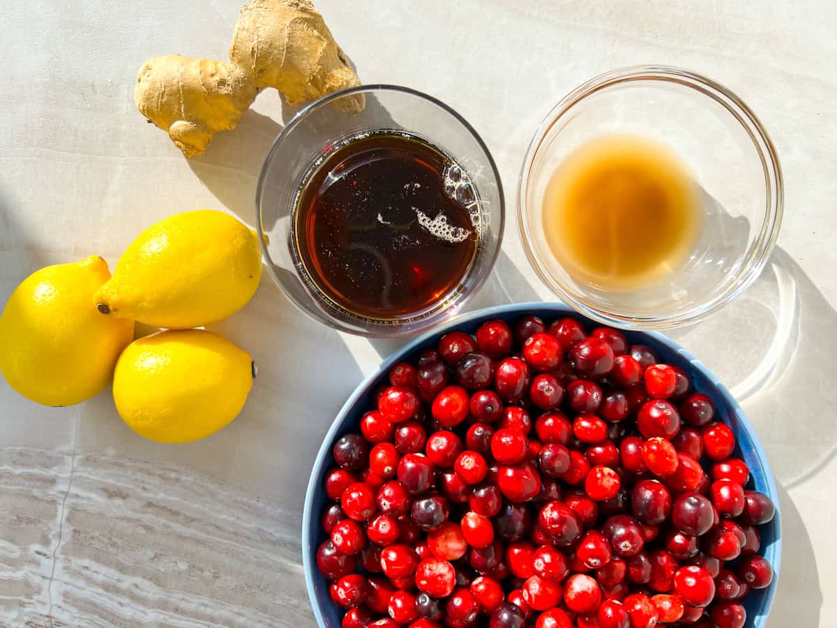 Cranberry mocktail ingredients sitting on a counter.