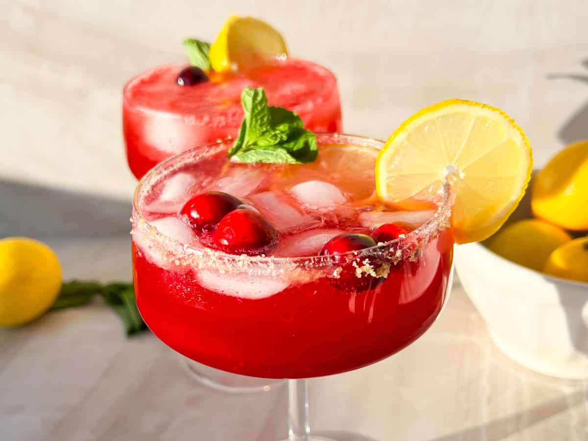 Finished cranberry ginger beer mocktail topped with fresh cranberries.