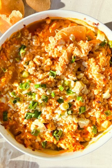 High Protein Buffalo Chicken dip with chips around it.