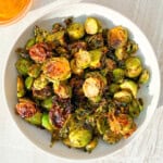 Finished hot honey brussel sprouts in a bowl.