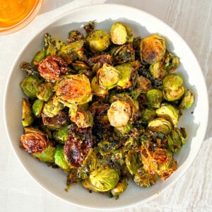 Finished hot honey brussel sprouts in a bowl.