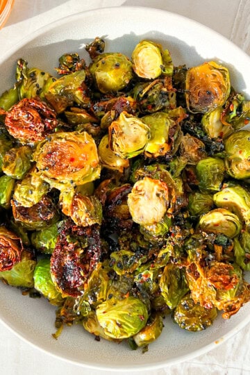 Finished hot honey brussel sprouts in a bowl.