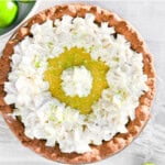 key lime pie with limes around it.