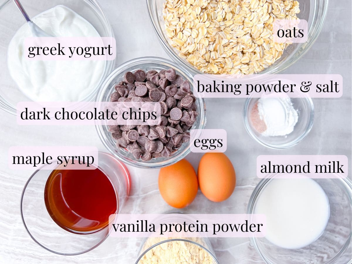 Ingredients for the baked oats without banana in separate bowls and labeled.