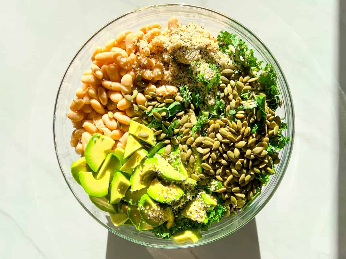 Kale and White Bean Salad in a clear bowl.