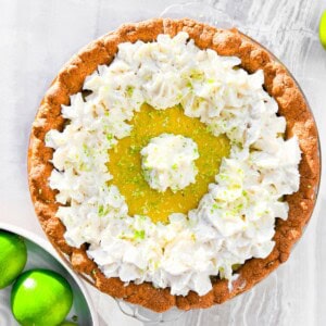 Gluten free key lime pie garnished with coconut whipped cream.