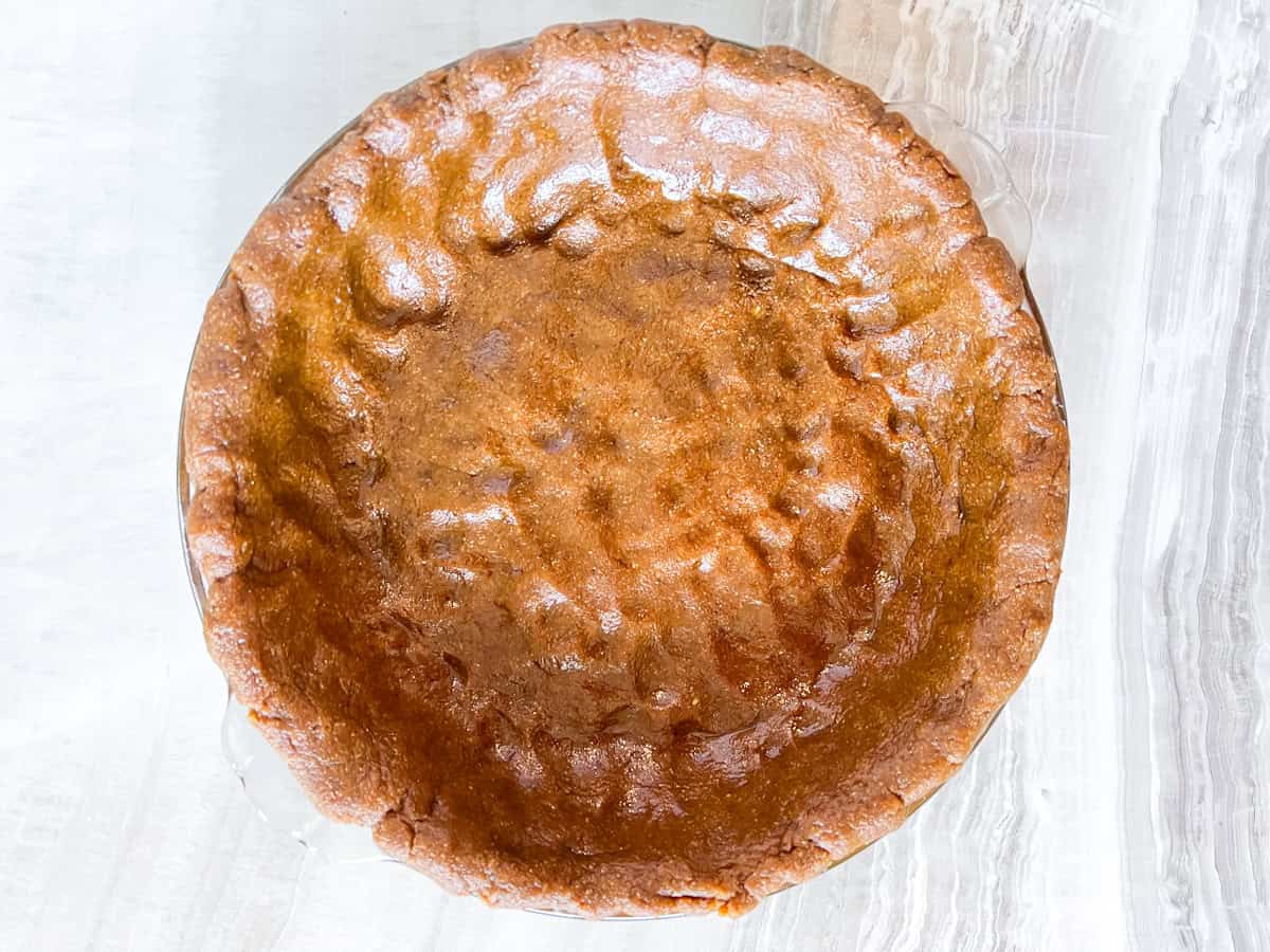 Key lime pie crust pressed into the pan.