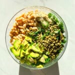 Kale and white bean salad in a large bowl.